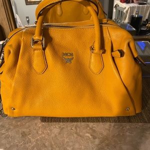 MCM original clean beautiful item. Have not used much no damage at all Appealing